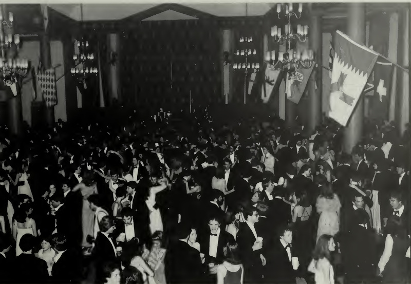 Pictured is a large group of students dancing at Fancy Dress in 1981, printed in black and white in the Calyx 1981.