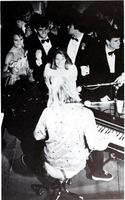 The image shows a small group of students dancing around a keyboard at Fancy Dress 1983, printed in the Calyx 1983.