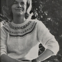 A young woman is photographed sitting down, facing the camera for the 1964 finals edition of the Southern Collegian.