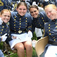 An image taken at VMI's 2022 commencement ceremony. The image is taken of 3 female cadets in the 25th class of coed. 